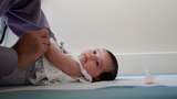 physical therapist and infant patient