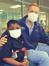 Matthew with CHOP staff