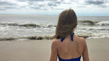 Girl on beach wearing patch Girl on beach wearing patch