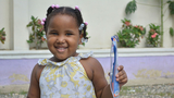 Girl holding toothbrush