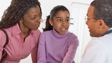 Doctor talking to patient and mother Doctor talking to patient and mother