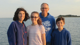 Food allergy patient with family outside smiling on dock