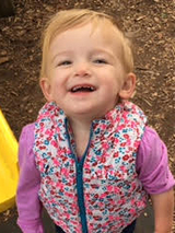 Olivia smiling outside