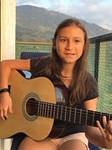 Kaitlyn playing the guitar