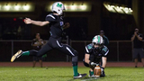 Sean kicking a football