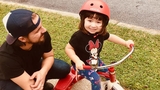 Jackie riding a tricycle