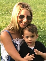 Baron and mom smiling outside
