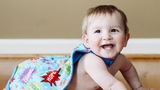Jaxon smiling wearing a cape
