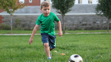 John playing soccer