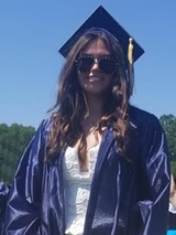 Kellyann smiling at graduation