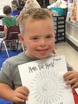 Bryant holding schoolwork