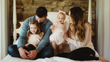family portrait on bed