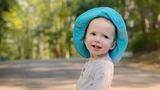 Nora smiling outside