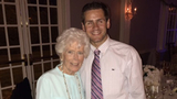Tommy CF patient standing with his Grandmother smiling