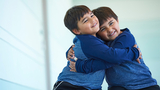 Aiden and Dillon Hugging