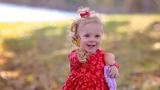Violet holding her doll