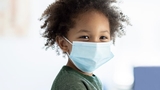 Young child wearing a mask