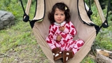 Xiomaras on a swing chair