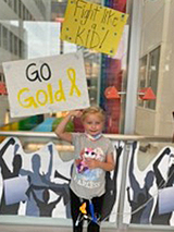 Brynn holding a sign