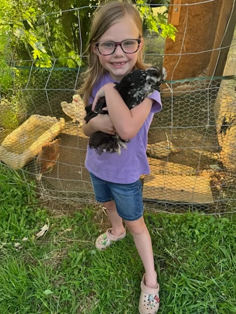Cassidy with her chicken