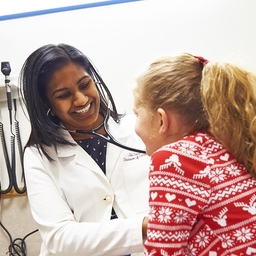 Doctor checking patient in primary care office