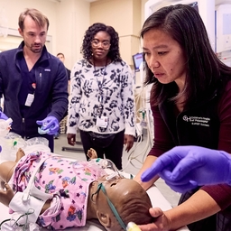 Yen Tay, MD (right), leading an ExPERT session.
