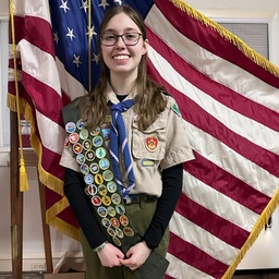 Alice with Eagle Scout badges
