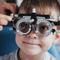 Child Eye Doctor boy getting eye exam