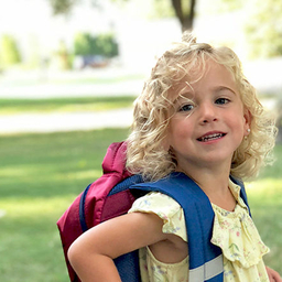 Maeve with her school backpack Maeve with her school backpack