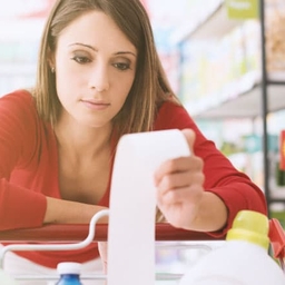 upset woman holding grocery receipt upset woman holding grocery receipt