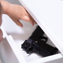Tips for Gun Safety little girl reaching for gun in drawer
