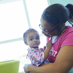Mother holding young daughter Mother holding young daughter