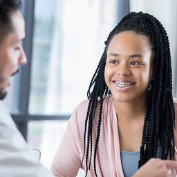 Doctor talking to teen patient Doctor talking to teen patient