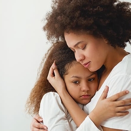 Mother hugging distraught daughter Mother hugging distraught daughter