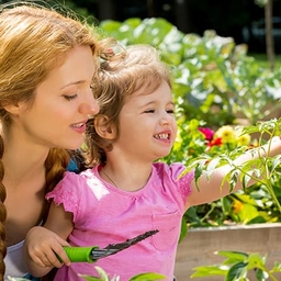 Mother and daughter in the garden Mother and daughter in the garden