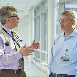 Drs. Behrens and Teachey talking Drs. Behrens and Teachey talking