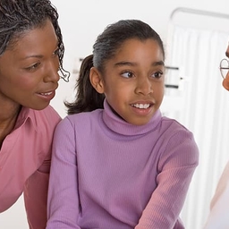 Doctor talking to patient and mother Doctor talking to patient and mother