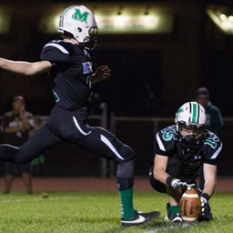 Sean kicking a football Sean kicking a football