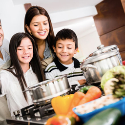 Delicious recipes from CHOP dietitians Family in kitchen cooking healthy meal together