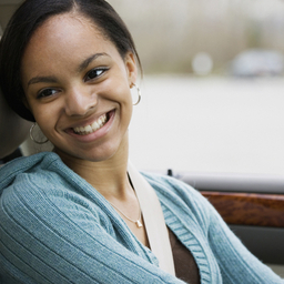 Teen girl driver in car smiling at father Teen girl driver in car smiling at father