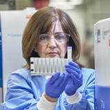 Researcher wearing protective gear in research lab