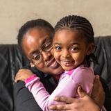 Mother and daughter hugging
