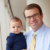 doctor holding a cute baby.
