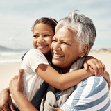 Grandmother hugging granddaughter