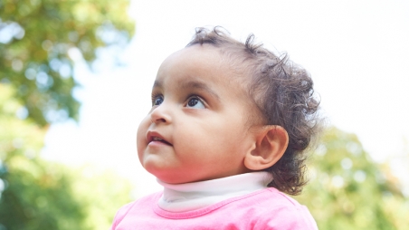 infant girl looking upward