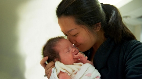 nurse holding baby