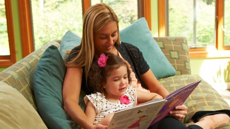 mother reading to daughter