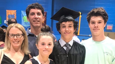 Ryan with his family at 8th grade graduation