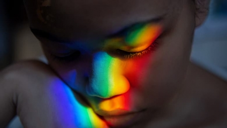 Rainbow right reflected on the face