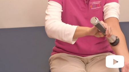 Person using vibration mechanism on arm